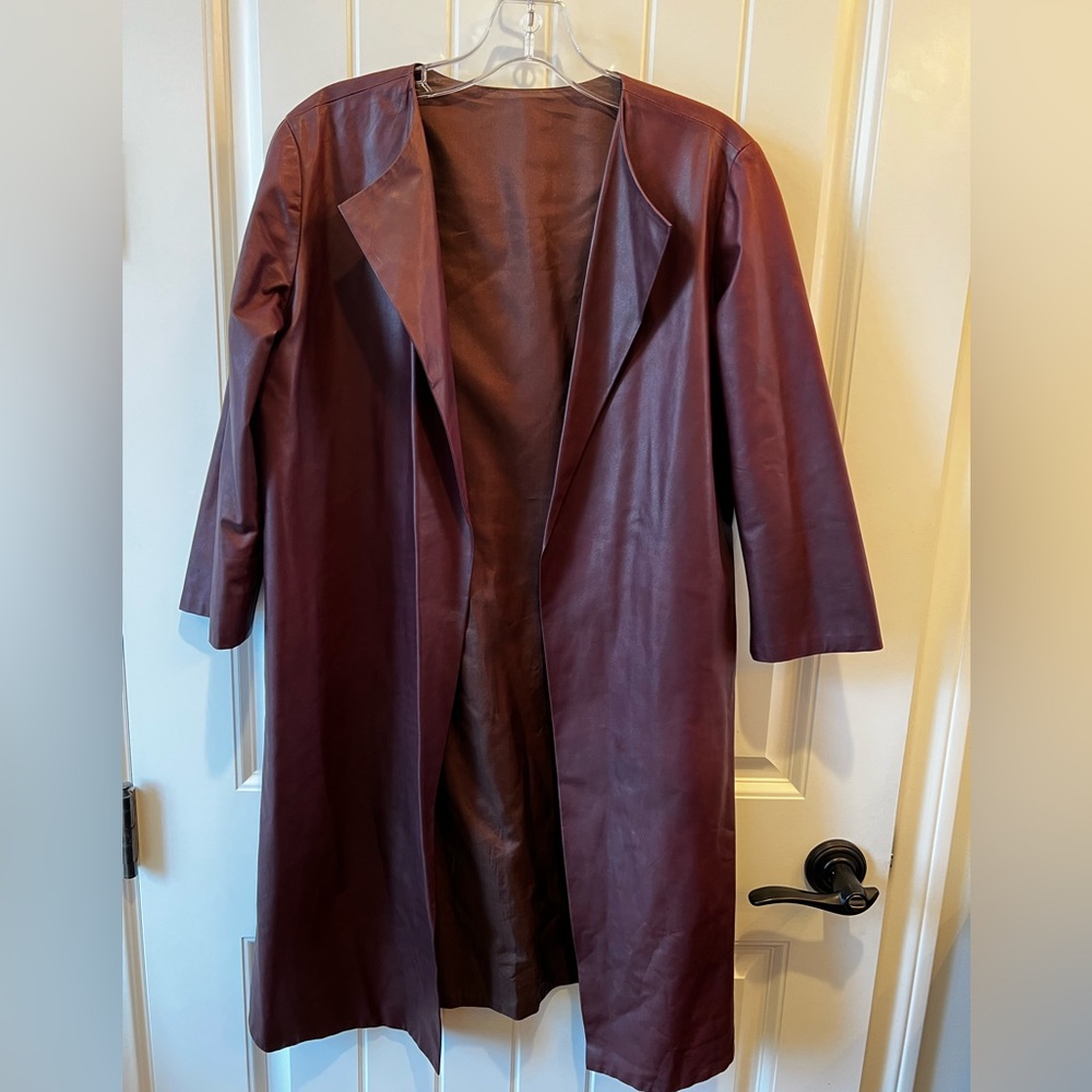 Plum colored womens small dust length jacket leather like lined from Europe